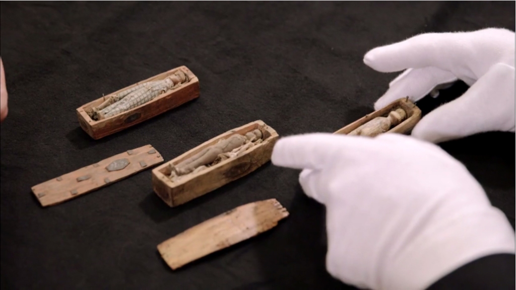 Tiny wooden dolls inisde tiny wooden coffins might be connected to notorious Edinburgh grave robbers and murderers Burke and Hare.