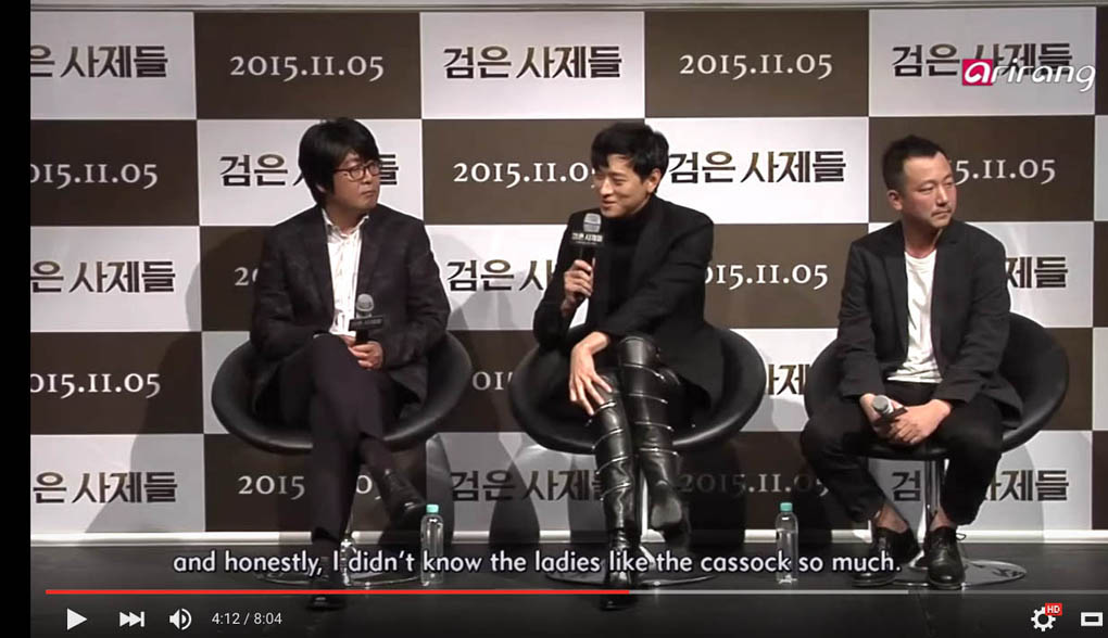 In a screen grab from an interview on Korean TV, actor Kang Dong Won talks about wearing a cassock, while praying the role of a seminary student, in the film The Priests.