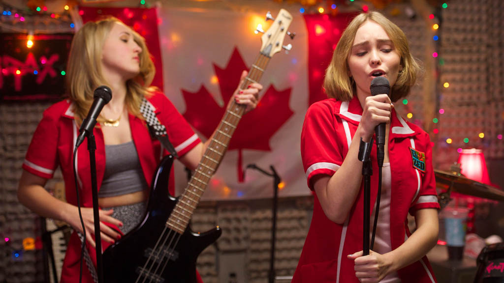 Harley Quinn Smith, left, and Lily-Rose Melody Depp give a decent rendition of O Canada during the closing credits of Kevin Smith's film Yoga Hosers. Depp even sings some of the French verses.